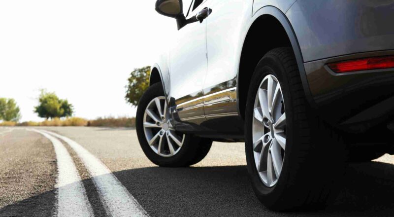 close up of car tire on road