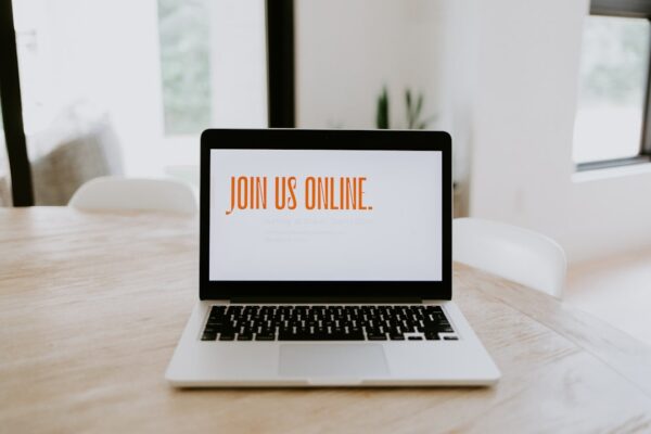 Image of computer with "join us online" text featured