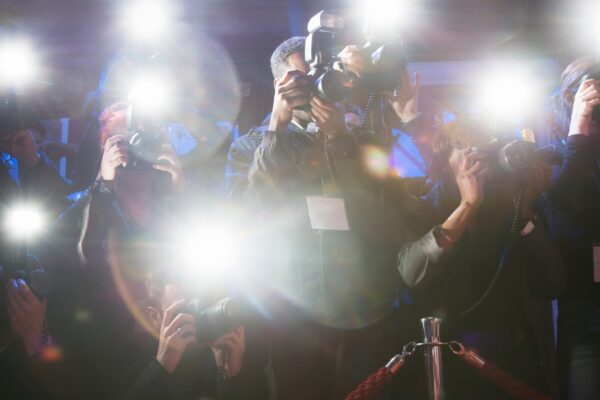 paparazzi cameras flashing