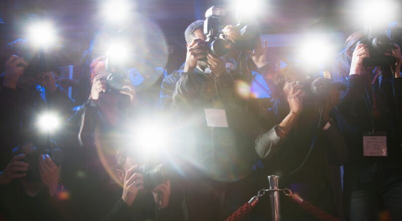 paparazzi cameras flashing