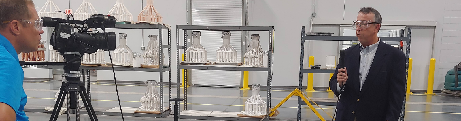 B2B news interview on manufacturing company work floor.